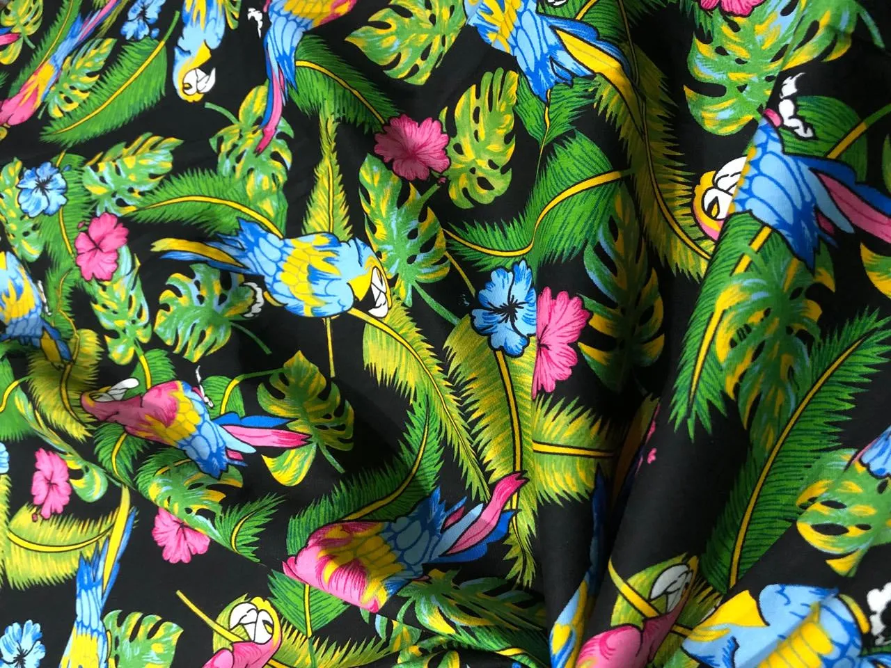 100% Cotton Poplin PRINT   58" wide RETRO BEACH available in 3 different prints pink ,orange, blue ,yellow ,green waves / black jungle with pink and blue parrots and flowers AND blue with lavender pink flowers