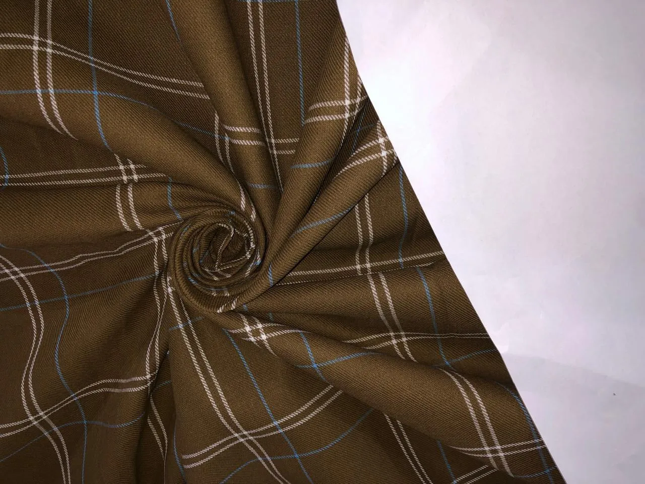 100% Cotton twill  plaids with  available in 4 colors REDS, BLUES and GREENS/GREEN,RUSTY BROWN , BLUE AND BROWN,WHITE AND BLUE AND GREEN AND BLACK